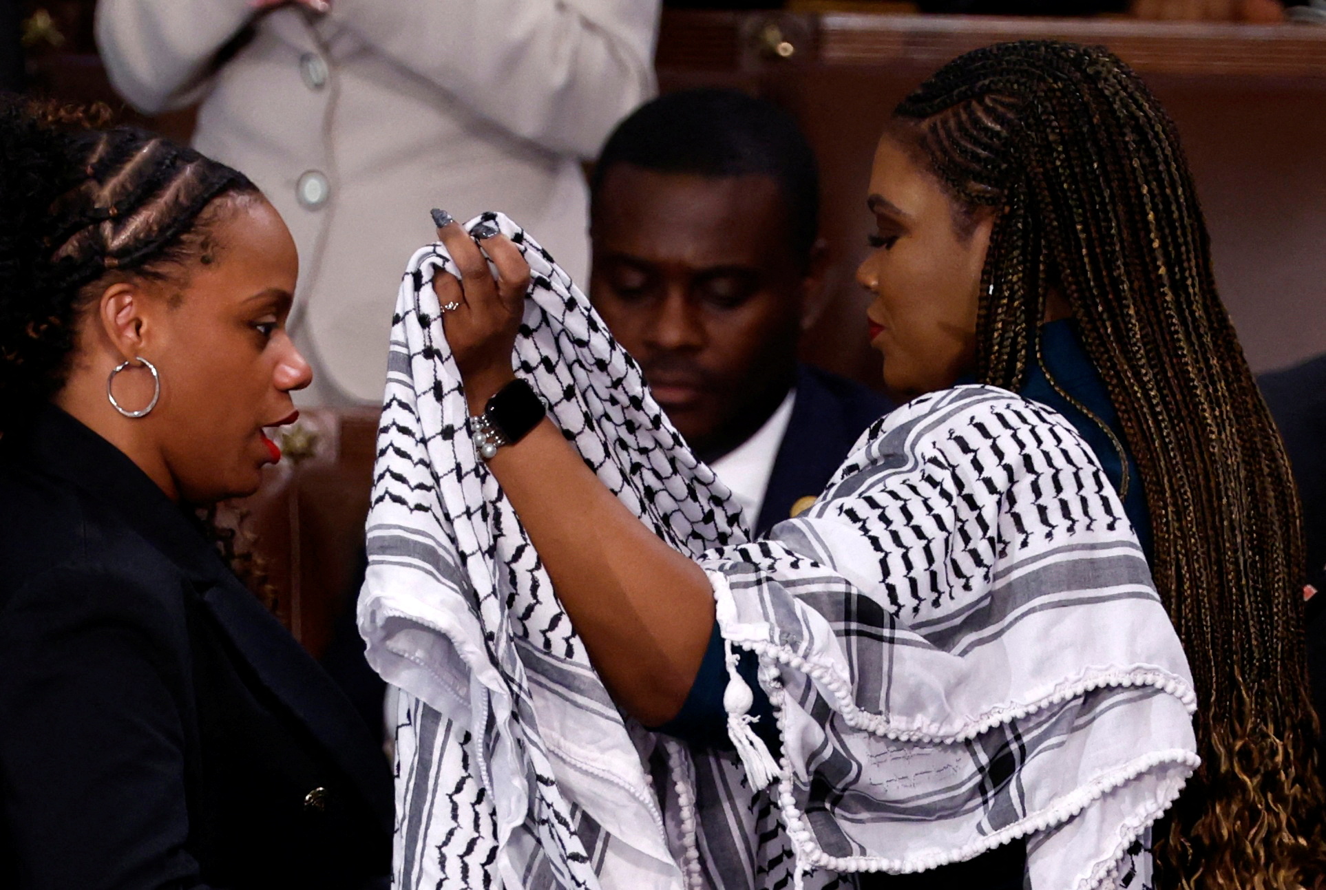 Summer Lee puts a keffiyeh on Cori Bush.