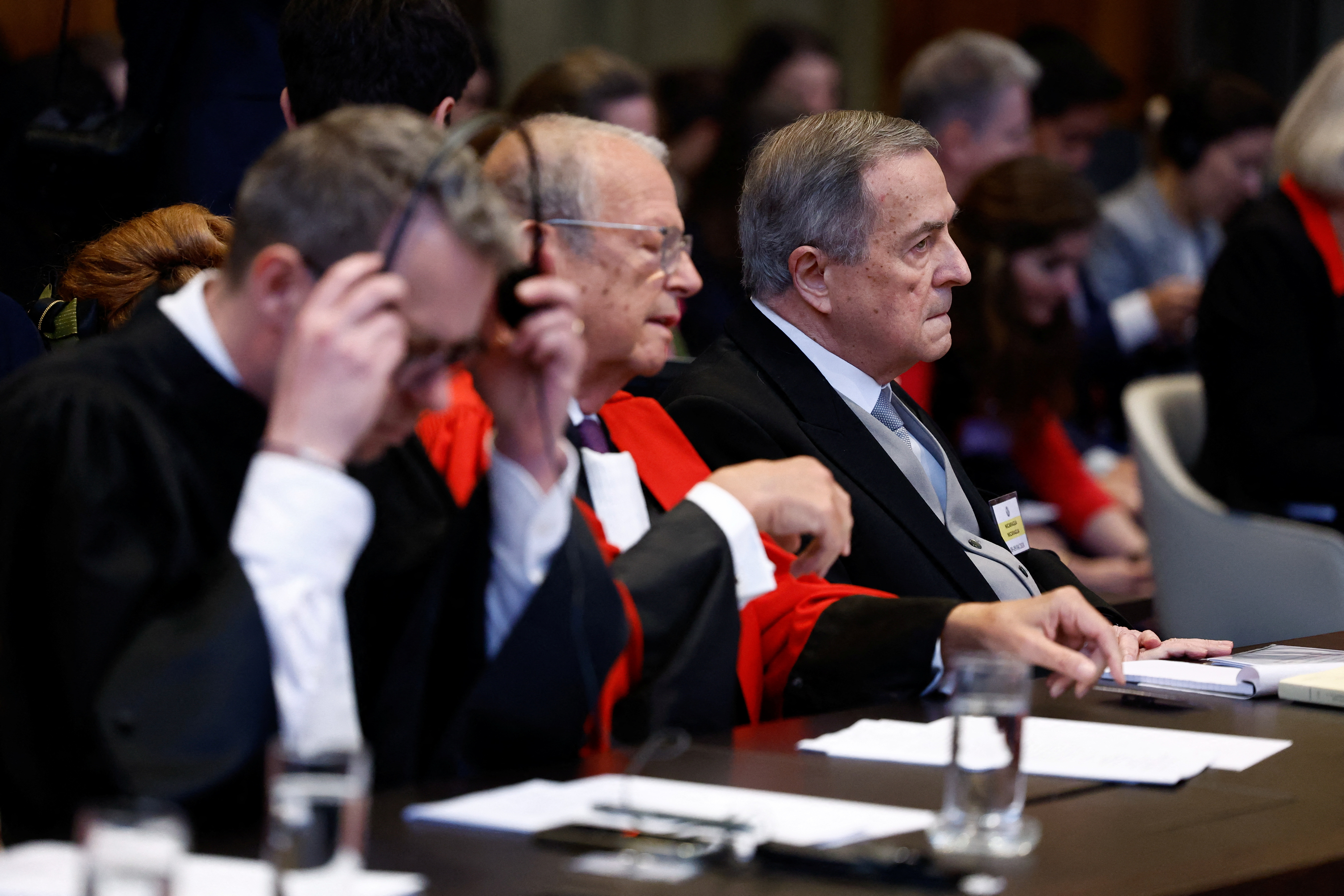 Nicaraguan Ambassador Carlos Jose Arguello Gomez sits next to lawyer Alain Pellet as Nicaragua is set to ask the International Court of Justice on Monday to order Berlin to halt military arms exports to Israel and reverse its decision to stop funding U.N. Palestinian refugee agency UNRWA, in The Hague, Netherlands, April 8, 2024. REUTERS/Piroschka van de Wouw
