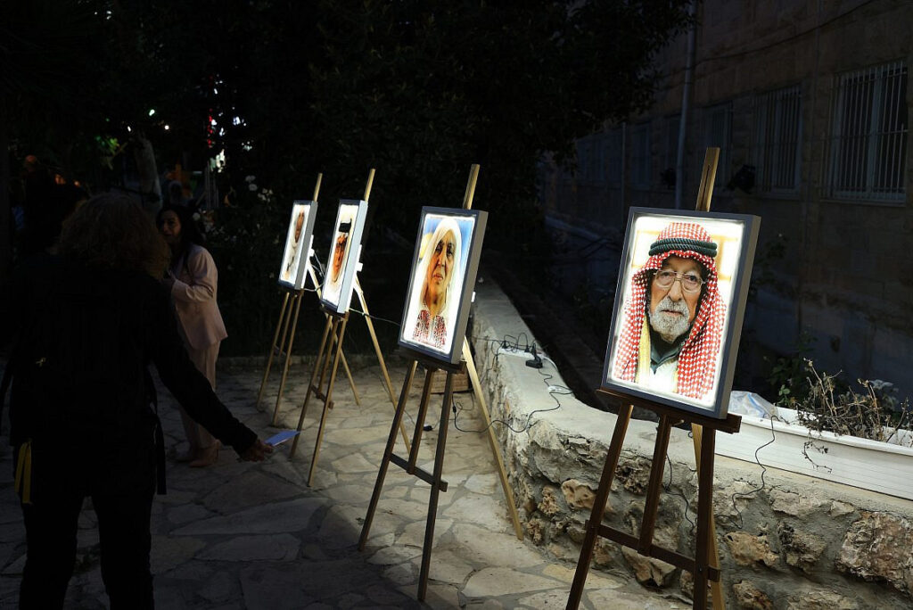 Photos of Palestinian refugees displayed at the entrance to the Joint Nakba Remembrance Ceremony in Beit Jala, the West Bank, May 14, 2025. (Combatants for Peace)